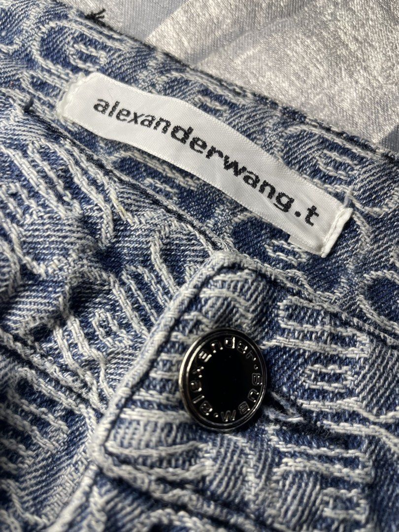 Alexanderwang.t Monogram Denim Jeans Size L (Category: Jeans) located in San Fernando. Submitted by theglobalgoods (Listing ID 1465273683, Image 3). Description: - Brand: Alexanderwang.t - Design: All-over monogram print in blue and white - Fit: High rise, straight leg - Material: 100% cotton - Size: Large - Details: Classic five-pocket design, standard belt loops, branded silver-tone metal button closure, and black leather logo patch at the back
