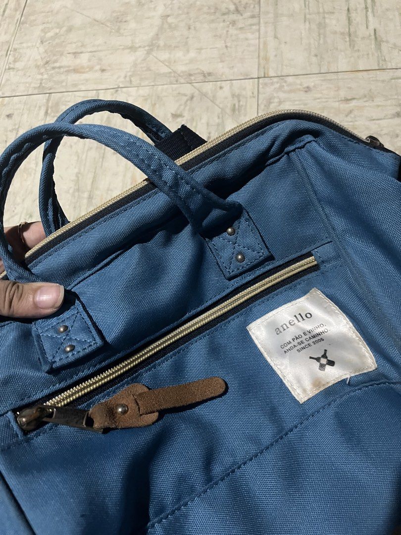 Anello Blue Canvas Shoulder Bag (Category: Backpacks) located in Makati City. Submitted by byamary (Listing ID 1465312830, Image 1). Description: - Authentic Anello canvas bag in classic blue - Dual top handles and adjustable shoulder strap for versatile wear - Front zip pocket with stylish leather pull tab and woven brand patch - Elegant gold-tone hardware details - Multiple compartments for easy organization - Durable fabric, ideal for daily co