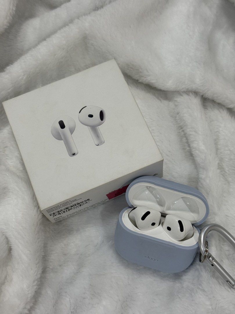 Apple AirPods 4 (Category: Earphones) located in Cavite. Submitted by jeramiea (Listing ID 1465247693, Image 1). Description: - Authentic Apple AirPods 4 - Clean condition, well-maintained inside and out - Includes original retail box, manual, charging case, and both earbuds - Free blue Elago silicone case with metal carabiner clip attached - RFS: Decluttering - Meet-ups or shipping via buyer's preferred courier.