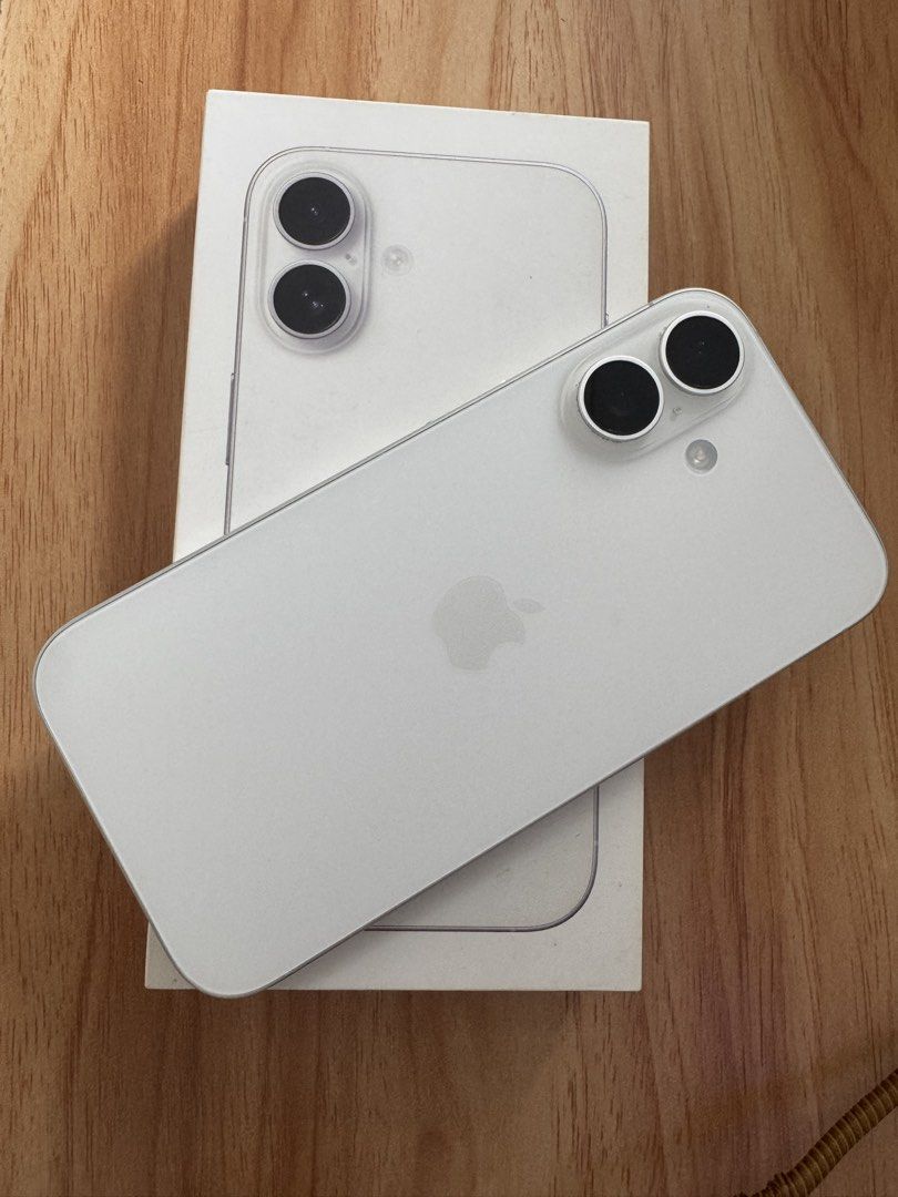 Apple iPhone 16 White (Category: iPhone 16 Series) located in Manila. Submitted by bokieee022194 (Listing ID 1465200979, Image 2). Description: White iPhone 16. Battery health at ninety-six percent, cycle count two hundred twenty-eight. First used in December 2024. Screen is clean, back glass has no cracks. Includes the original box. Works smoothly without issues. Location: Don Antonio QC Can do meet ups nearby or shipping via LBC.