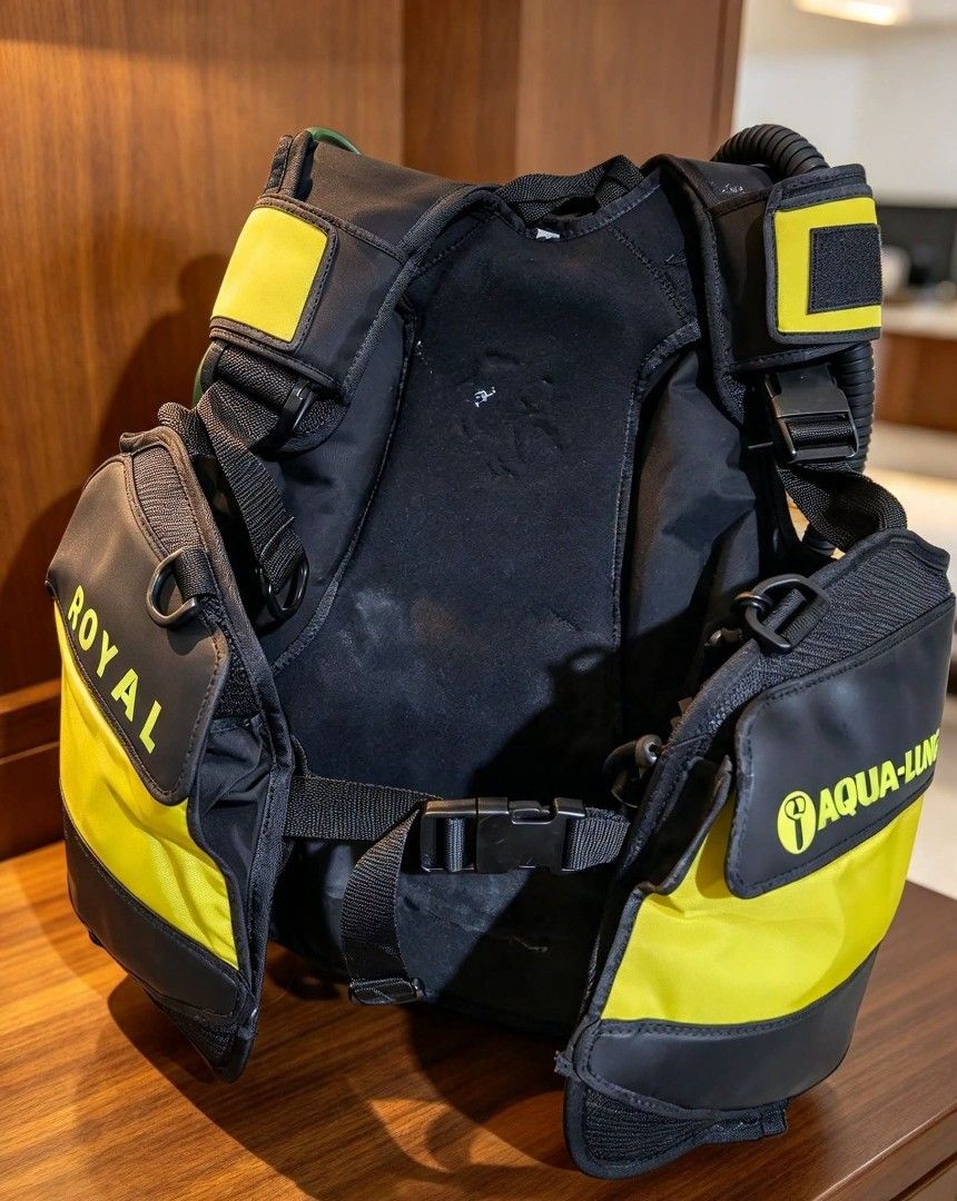 Aqua Lung Royal Scuba Diving BCD Buoyancy Compensator Jacket (Category: Water Sports) located in Naga. Submitted by solamia (Listing ID 1465178843, Image 1). Description: - Brand: Aqua Lung Royal - Type: Scuba diving buoyancy compensator (BC) jacket - Color: Black and yellow design - Features: Integrated inflator hose and multiple dump valves - Fit: Fully adjustable straps and secure waist belt - Build: Sturdy plastic backplate for stability - Co