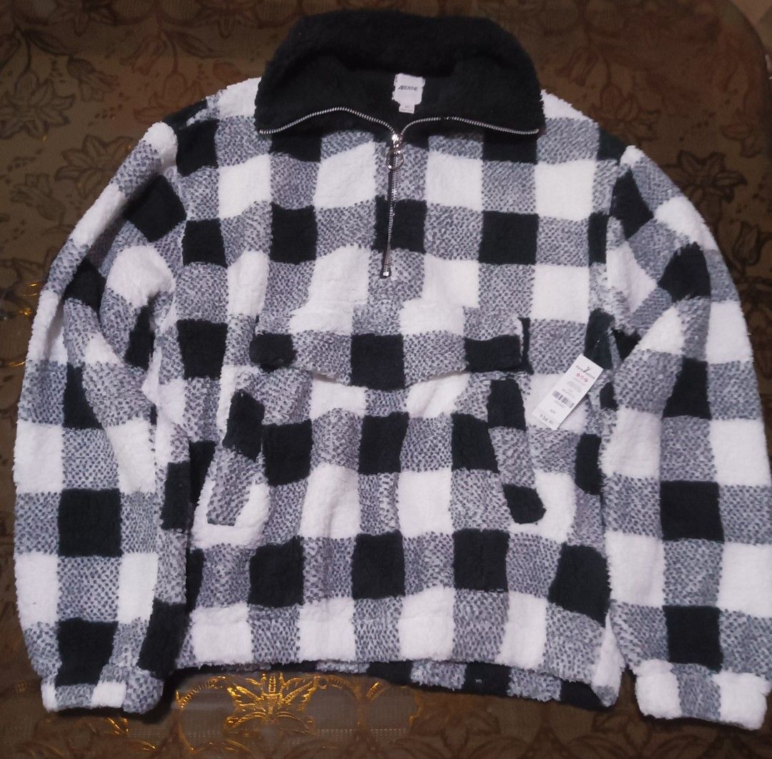 Ardene Black White Buffalo Plaid Sherpa Pullover Sweater (Category: Longsleeves) located in Davao. Submitted by annie_wind (Listing ID 1465241092, Image 3). Description: - Brand: Ardene - Style: Black & white buffalo plaid sherpa pullover - Size: Small - Details: Quarter-zip neckline with ring pull, front kangaroo pocket - Material: 100% polyester (super cozy!) - Condition: Brand new with original retail tags attached ($34.90), never worn.