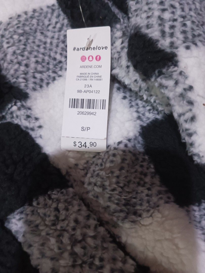 Ardene Black White Buffalo Plaid Sherpa Pullover Sweater (Category: Longsleeves) located in Davao. Submitted by annie_wind (Listing ID 1465241092, Image 2). Description: - Brand: Ardene - Style: Black & white buffalo plaid sherpa pullover - Size: Small - Details: Quarter-zip neckline with ring pull, front kangaroo pocket - Material: 100% polyester (super cozy!) - Condition: Brand new with original retail tags attached ($34.90), never worn.