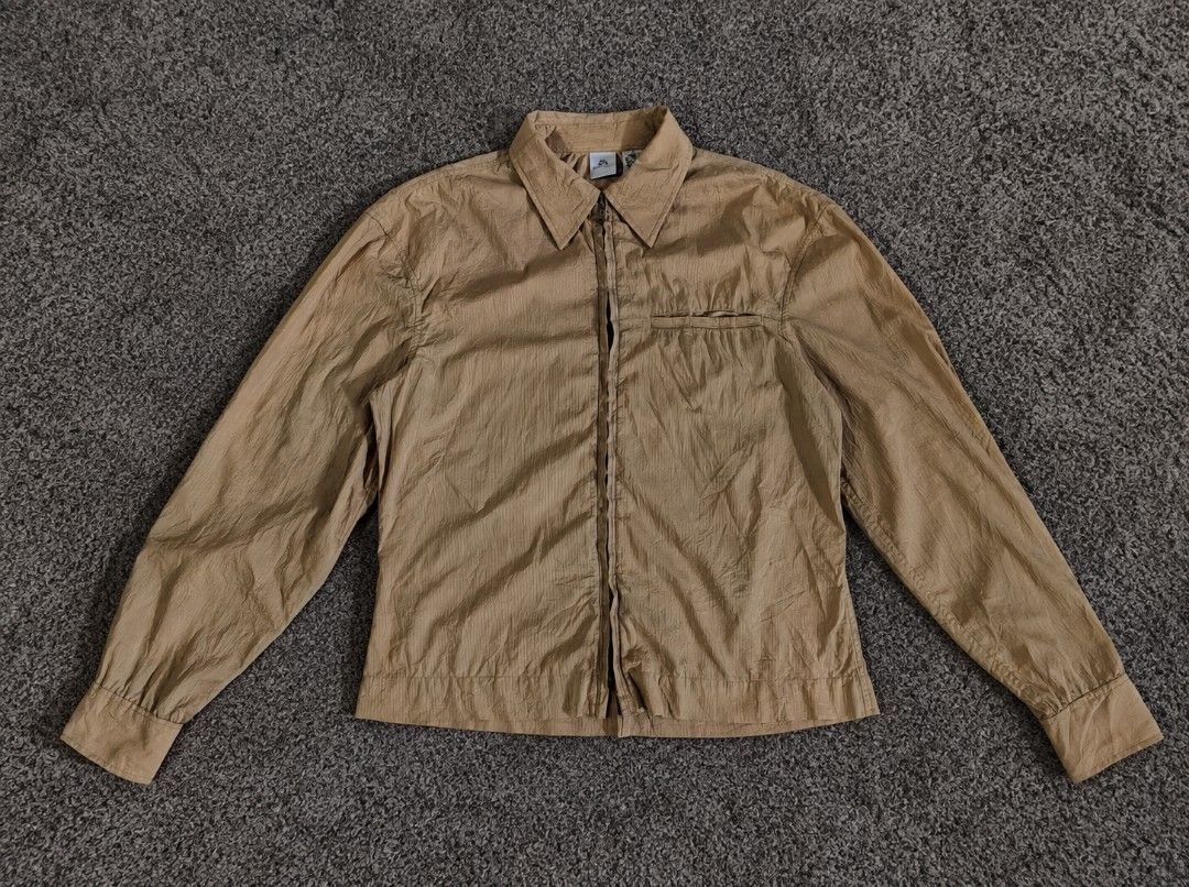 Armani Exchange Brown Zip-Up Jacket (Category: Coats, Jackets and Outerwear) located in Manila. Submitted by livedolphin_68dee2 (Listing ID 1465238495, Image 1). Description: - Brand: Armani Exchange - Size: Small - Color: Brown with subtle vertical stripes - Material: Soft textured lightweight fabric - Closure: Full front dual-zipper - Pockets: Convenient chest welt pocket - Details: Classic shirt collar and button cuffs - Condition: Excellent p