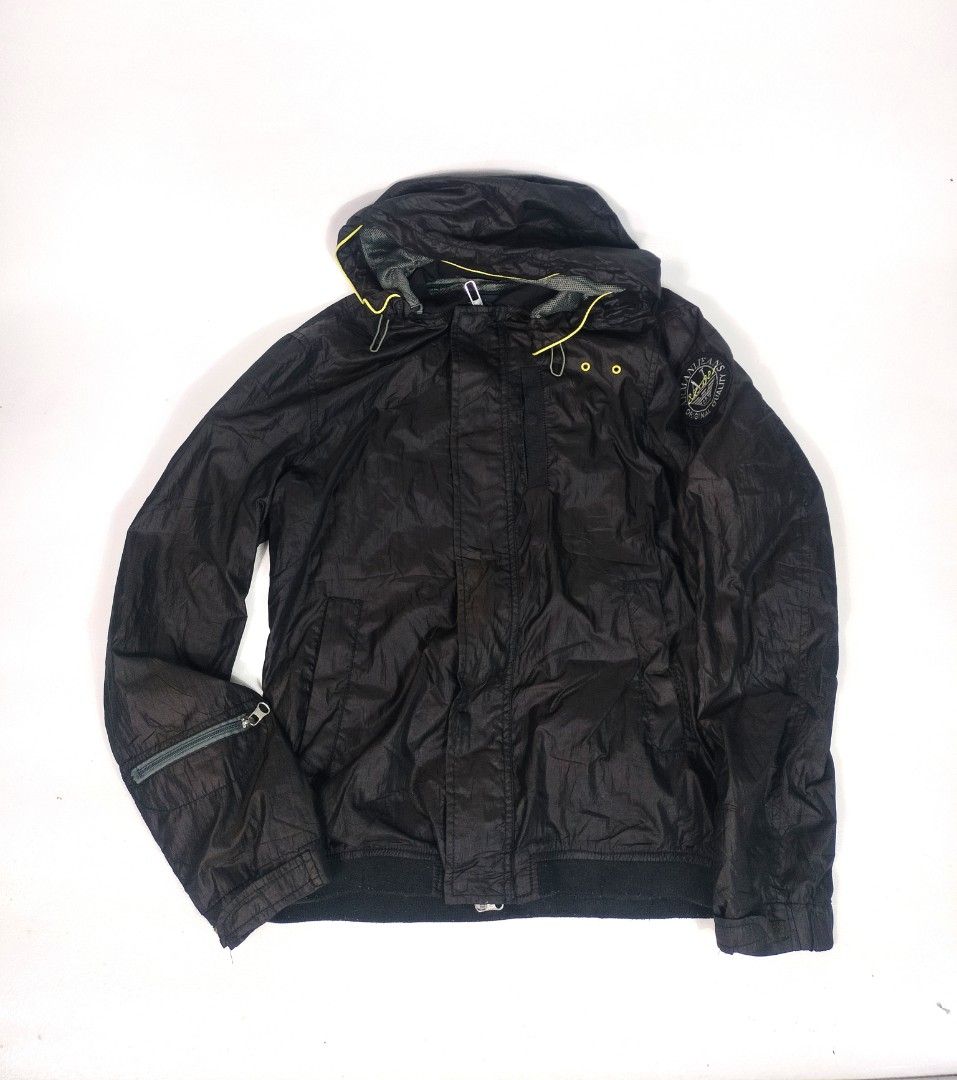 Armani GA Vintage Windbreaker (Category: Coats, Jackets and Outerwear) located in Manila. Submitted by callmetin (Listing ID 1465297043, Image 1). Description: Condition : Verygood Size : Small Dimension 👇 Chest : 21 Lenght : 26 Shoulder : 17 Sleeve : 24 Issue : 2 snaplock Button Damage But may zipper naman sya . - Color: Black with vibrant yellow trim details on the hood and drawstrings - Lining: Breathable mesh lining inside for comfort - Bran