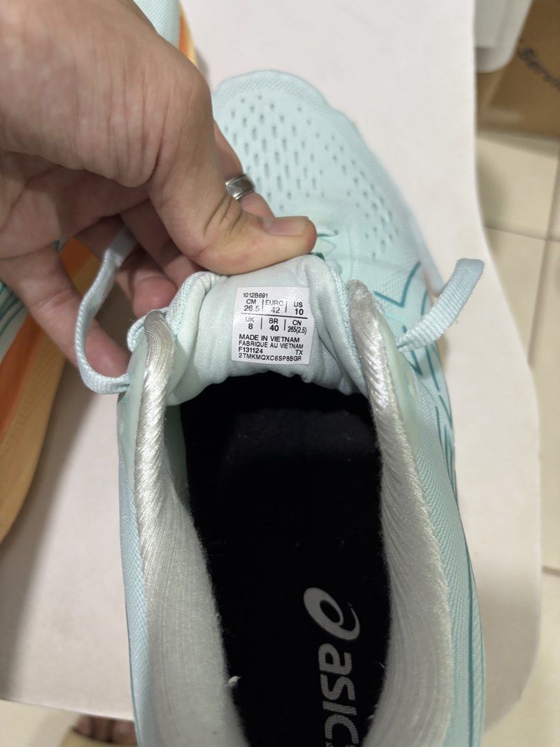 Asics Glideride Max Light Teal Running Shoes Size US 10 (Category: Casual Shoes) located in Manila. Submitted by jonard2297 (Listing ID 1465274946, Image 3). Description: - Brand/Model: Asics Glideride Max - Colorway: Light Teal, Orange, and Yellow - Size: US 10 / EU 42 / CM 26.5 - Condition: Lightly tested, outsoles show minor dirt - Defect: Small fabric tear near the left heel pull tab (see last photo) - Performance: Cushioning and grip still h