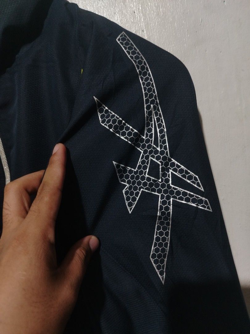 Asics Motiontherm Windbreaker Jacket (Category: Coats, Jackets and Outerwear) located in Rizal. Submitted by gmpastoffi75031 (Listing ID 1465322989, Image 3). Description: - Brand: Asics - dimes 23x27.5 - Color: Black with lime green and silver reflective accents - Features: Full zip closure, high collar, elastic cuffs, and Motiontherm tech print - Fabric: Lightweight with subtle honeycomb texture - Best for: Running, training, and casual sportsw