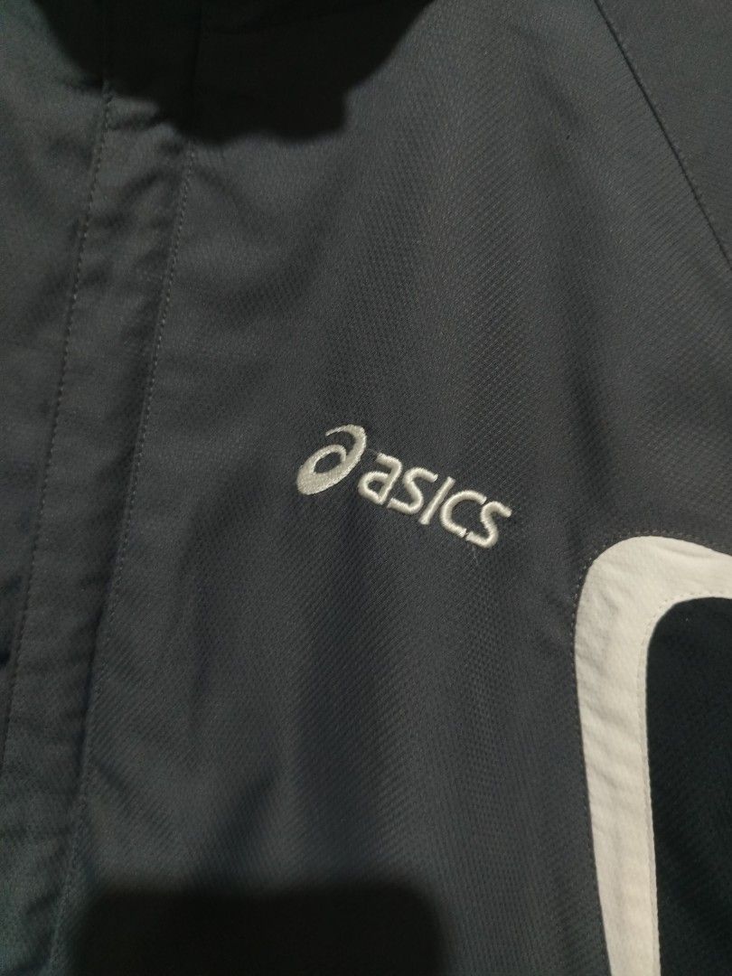 Asics Windbreaker packable hood (Category: Coats, Jackets and Outerwear) located in Rizal. Submitted by gmpastoffi75031 (Listing ID 1465345764, Image 2). Description: - Authentic retro grey Asics track jacket - dimes 22.5x27.5 - Stylish black and white contrast panels on the front - Stand-up collar with comfortable mesh lining - Full zip closure with convenient side pockets - Elastic cuffs and hem for a snug fit - Lightweight material, ideal for 