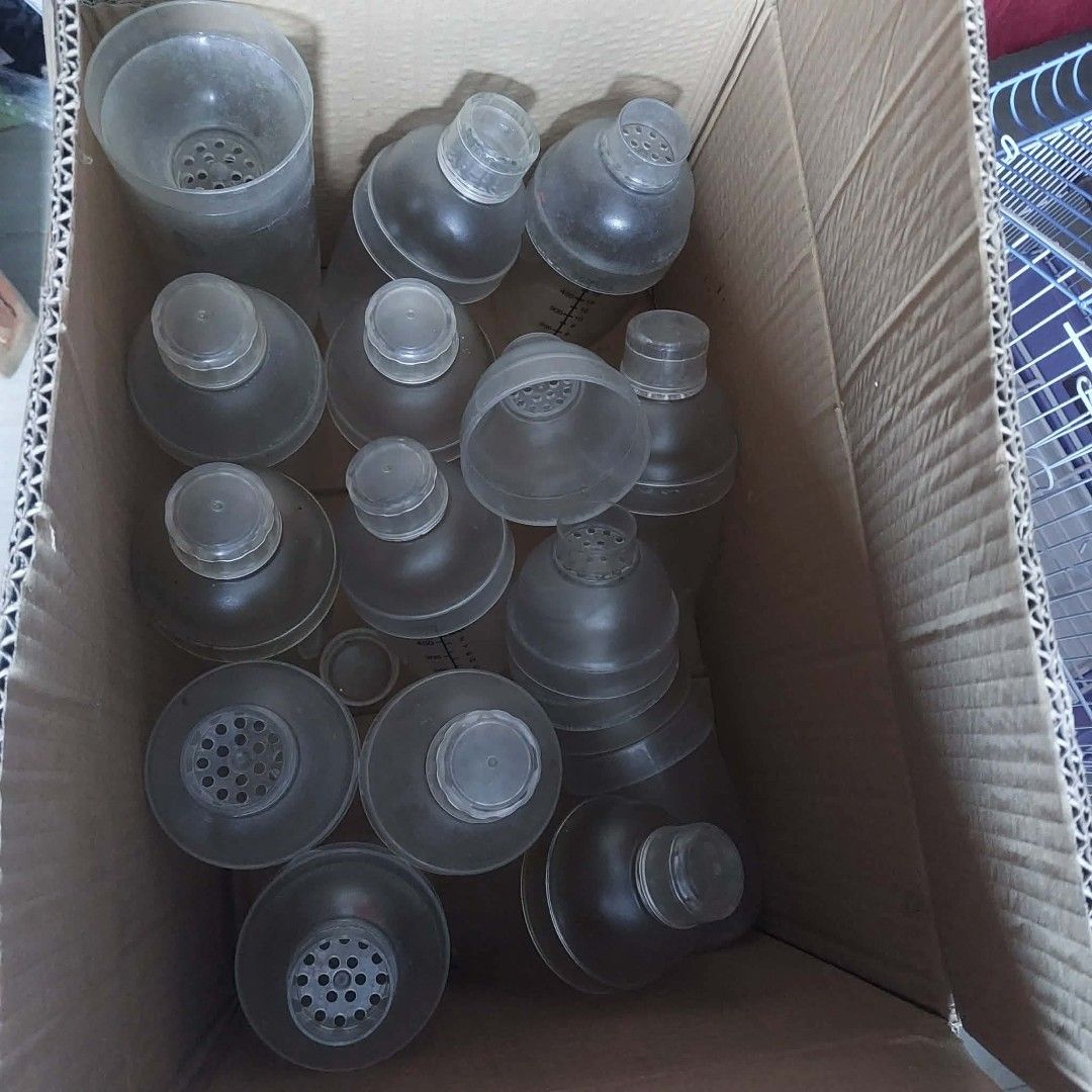 Assorted Plastic Shaker Bottles Take All (Category: Water Bottles & Tumblers) located in Taguig. Submitted by i_am_blessygrei (Listing ID 1465231260, Image 1). Description: - Bulk lot of translucent plastic shaker bottles in various sizes (500cc, 700cc, and a tall 1000cc) SHAKER 1 1L, 5PCS 700ML, 7PCS 500ML - Features clear measurement markings in CC and ML - Includes secure screw-on caps and built-in strainer lids - Great for protein shakes, fit