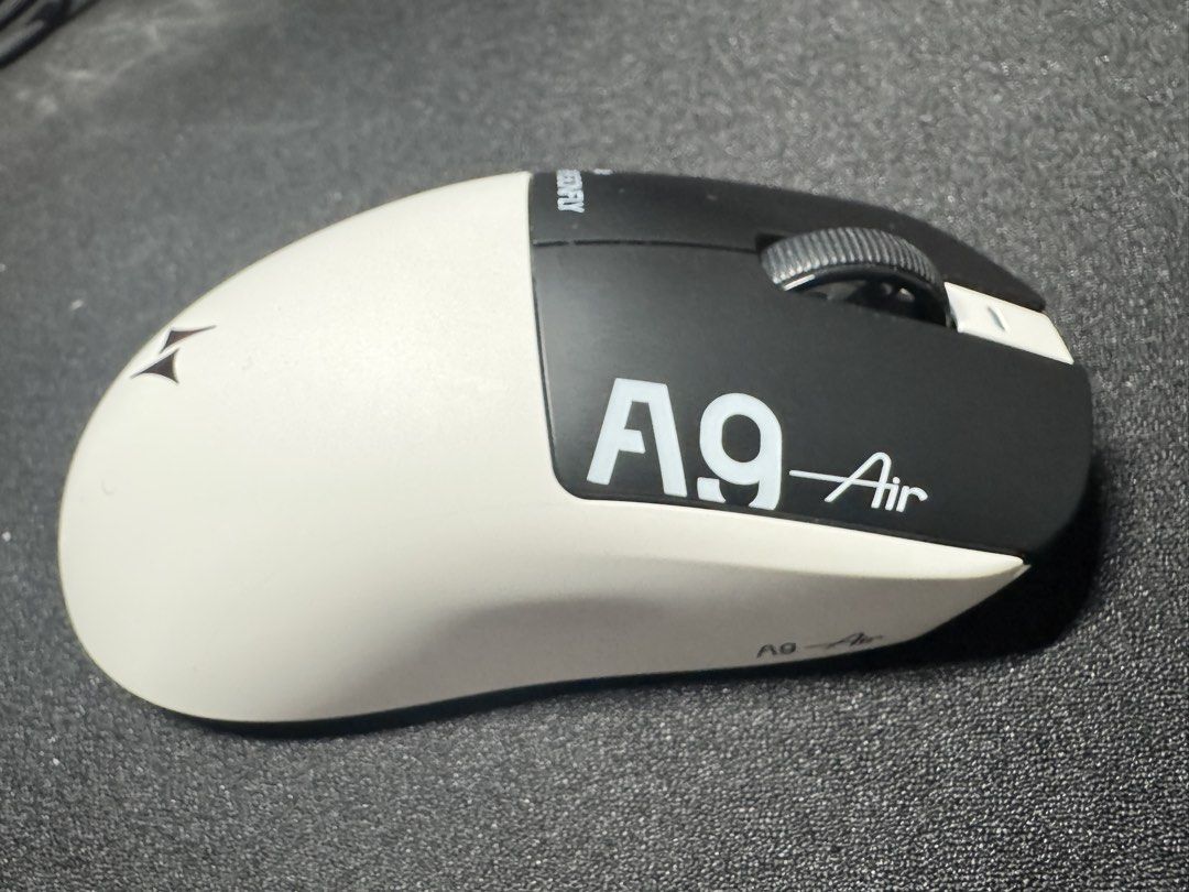 ATK Dragonfly A9 Air Wireless Gaming Mouse (Category: Mouse & Mousepads) located in Quezon City. Submitted by kvnmercado (Listing ID 1465332352, Image 3). Description: - Model: ATK Dragonfly A9 Air Gaming Mouse - Colorway: Black and White - Condition: Clean, minimal signs of use, tested and 100% working - Design: Ultra-lightweight with ergonomic shape and side buttons - Inclusions: Original packaging, warranty card, and accessories as pictured Us