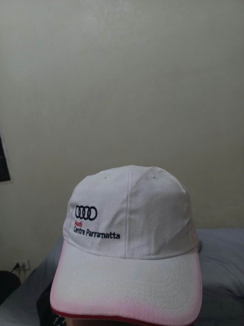 Audi Centre Parramatta White Cap Hat (Category: Caps & Hats) located in Davao. Submitted by thegraildept2026 (Listing ID 1465178705, Image 1). Description: - Authentic Audi Centre Parramatta merchandise - Classic white baseball cap with adjustable strapback closure - Features the iconic black four rings logo and red/black lettering - Styled with a curved brim and striking red piping trim - Perfect condition and ready to wear.