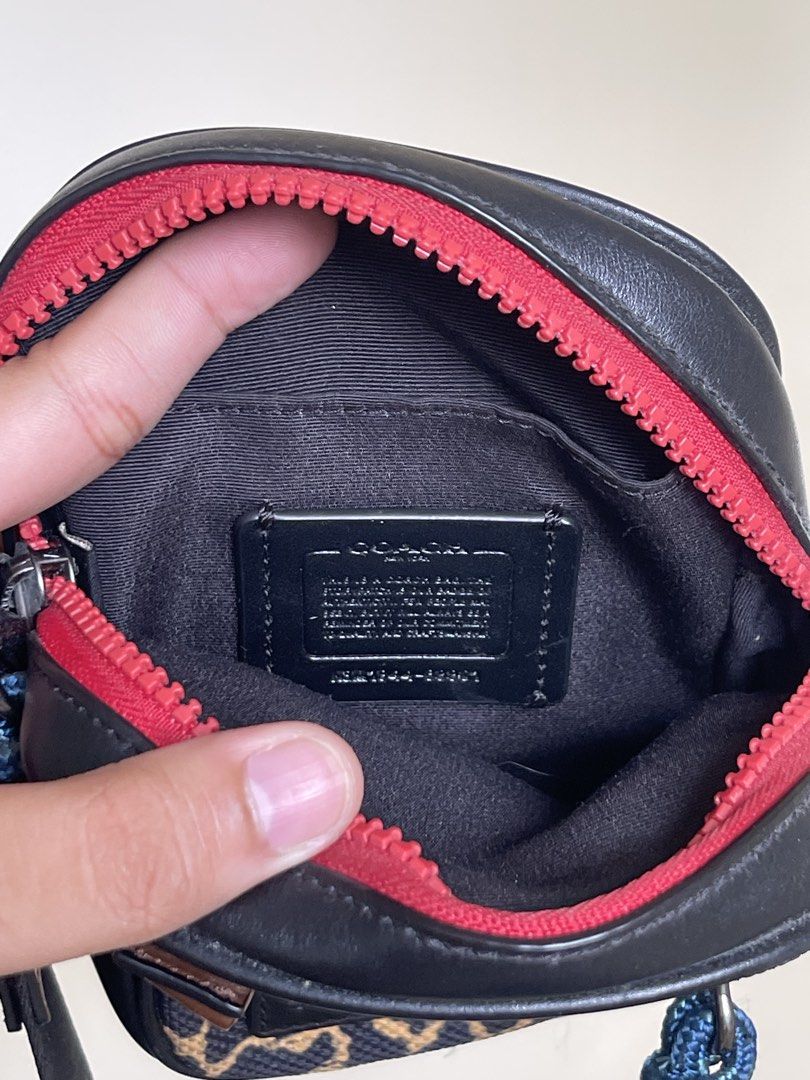 Authentic Coach Leopard Print Crossbody Bag (Category: Sling Bags) located in Manila. Submitted by timmyyyyyy69 (Listing ID 1465274687, Image 3). Description: - Brand: Coach - Design: Leopard print canvas with black leather trim and bright red front zipper - Features: Adjustable black strap with leather accents, dark fabric lining, and official Coach leather creed patch inside - Size: Compact and lightweight, ideal for daily essentials - Style: H