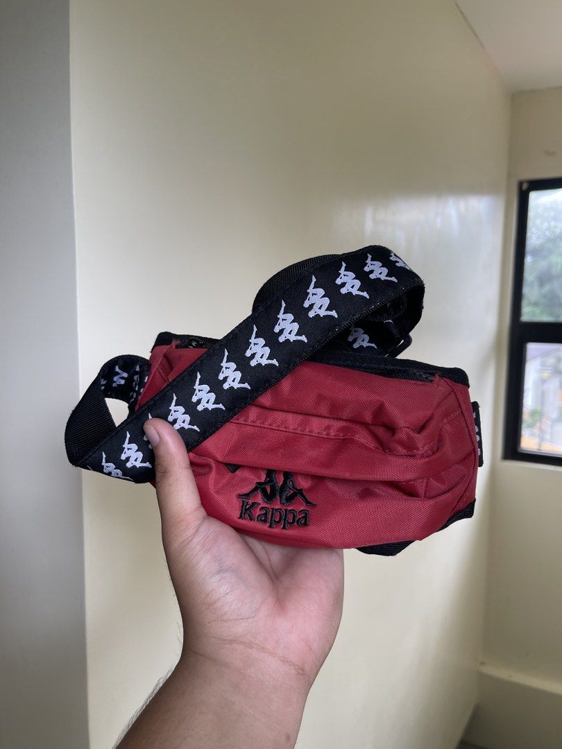 Authentic Kappa Red Marsupio Pouch Bag Small (Category: Purses & Pouches) located in Manila. Submitted by timmyyyyyy69 (Listing ID 1465274804, Image 1). Description: - Authentic red Kappa small pouch bag - Iconic black Omini logo repeated across the strap - Secure zipper closure with Kappa branded pulls - Inner tags intact (100% polyester) - Great streetwear accessory for hands-free daily use - Condition: Excellent / Ready to ship - RFS: Declutte