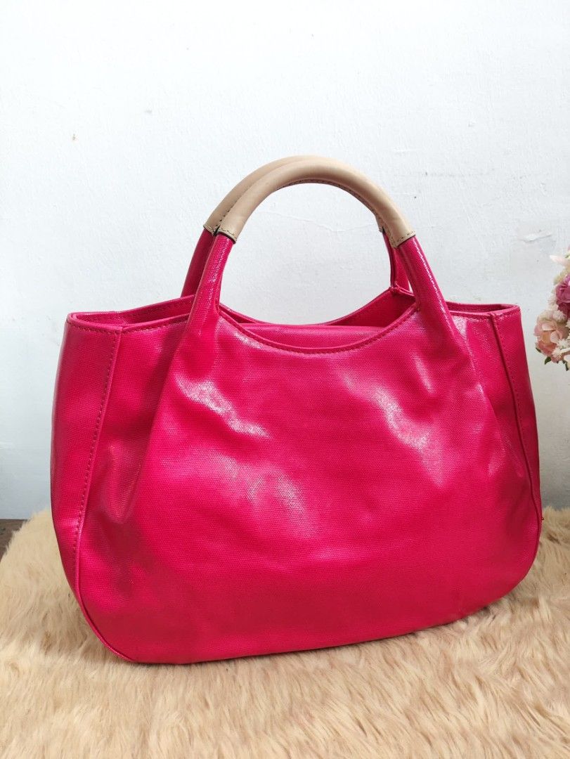 Authentic Kate Spade fulton patent dumpling hand bag (Category: Tote Bags) located in Rizal. Submitted by hsiri1128 (Listing ID 1465299266, Image 3). Description: 💯✔️Legit CONDITION : 9/10 ISSUE / FLAWS : None. still in excellent condition MATERIAL : Coated patent material w/ gold hardwares DETAILS : Light weight only. Spacious inside. stand alone. Magenta color. fit ipad inside and folding umbrella.