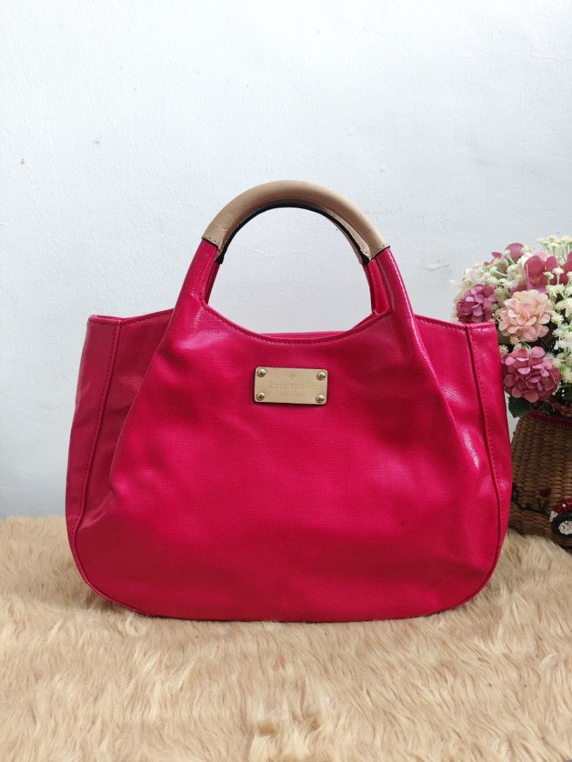 Authentic Kate Spade fulton patent dumpling hand bag (Category: Tote Bags) located in Rizal. Submitted by hsiri1128 (Listing ID 1465299266, Image 1). Description: 💯✔️Legit CONDITION : 9/10 ISSUE / FLAWS : None. still in excellent condition MATERIAL : Coated patent material w/ gold hardwares DETAILS : Light weight only. Spacious inside. stand alone. Magenta color. fit ipad inside and folding umbrella.
