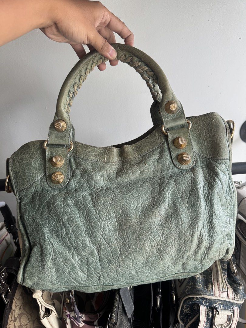 Balenciaga city bag (Category: Luxury Bags & Wallets) located in Quezon City. Submitted by streetgallerygarments (Listing ID 1465199754, Image 2). Description: Balenciaga Giant City Bag in a muted green leather, beautifully detailed with signature gold-tone giant hardware and hand-stitched braided handles..