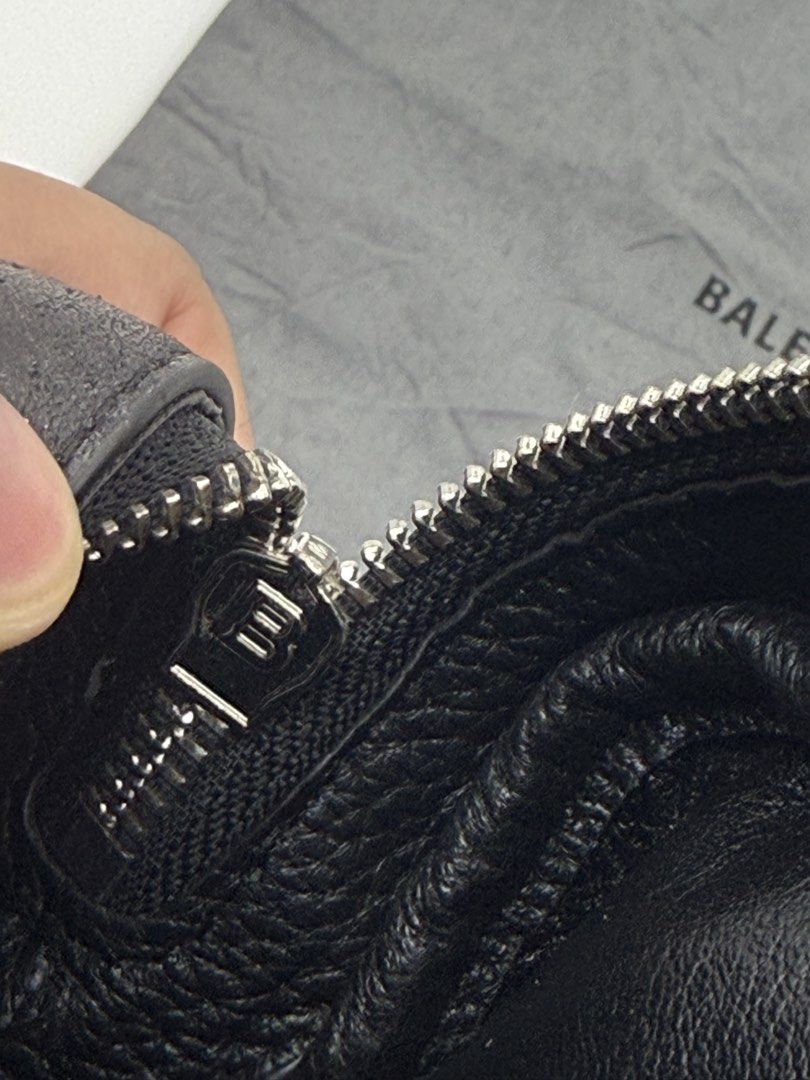 Balenciaga Everyday Camera Bag Black (Category: Cross-body Bags) located in Caloocan City. Submitted by rossvault2 (Listing ID 1465235636, Image 3). Description: - Balenciaga crossbody bag - Black textured leather with white front logo - Adjustable thin shoulder strap with silver-tone hardware - Secure top zip closure - Clean interior featuring a small slip pocket and card slots - Includes original grey Balenciaga dust bag - Condition: Excellent/
