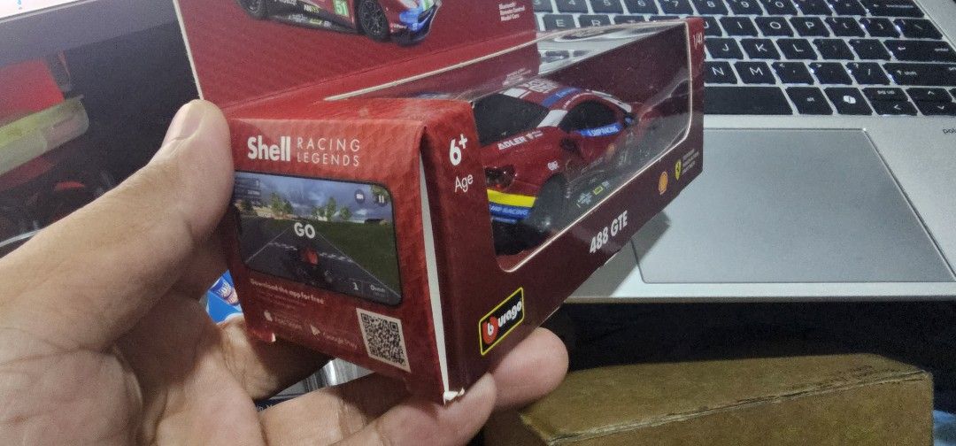 Bburago Ferrari 488 GTE Shell Racing Legends 1/41 Scale (Category: Vehicle & Diecast Models) located in Las Pinas. Submitted by xenoraine (Listing ID 1465338329, Image 2). Description: - Brand: Bburago 1/41 scale Ferrari 488 GTE Shell Racing Legends - Features authentic #51 SMP Racing, Adler, UPS, and Shell decals with 1949-2019 anniversary roof graphics - App-compatible Bluetooth remote control functionality - Condition: Slightly used inside ori
