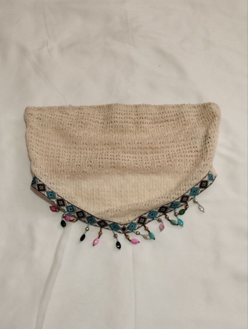 Beaded Trim Crochet Tube Top (Category: Sleeveless) located in Manila. Submitted by nicole_alega (Listing ID 1465229949, Image 3). Description: - Style: Beige crochet tube top with knit texture - Details: Geometric embroidered trim with colorful hanging beads and charms - Fit: Secure elastic top - Occasion: Ideal for beach trips and music festivals - Condition: Worn once, excellent overall condition.