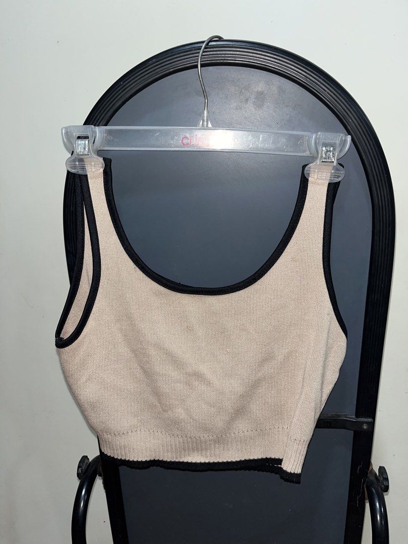 Beige and black ribbed knit crop top (Category: Sleeveless) located in Rizal. Submitted by bypc5678 (Listing ID 1465355086, Image 2). Description: - Color: Beige with chic black contrast trim - Material: Stretchy, comfortable ribbed knit - medium to large FREE for 300 peso purchase.