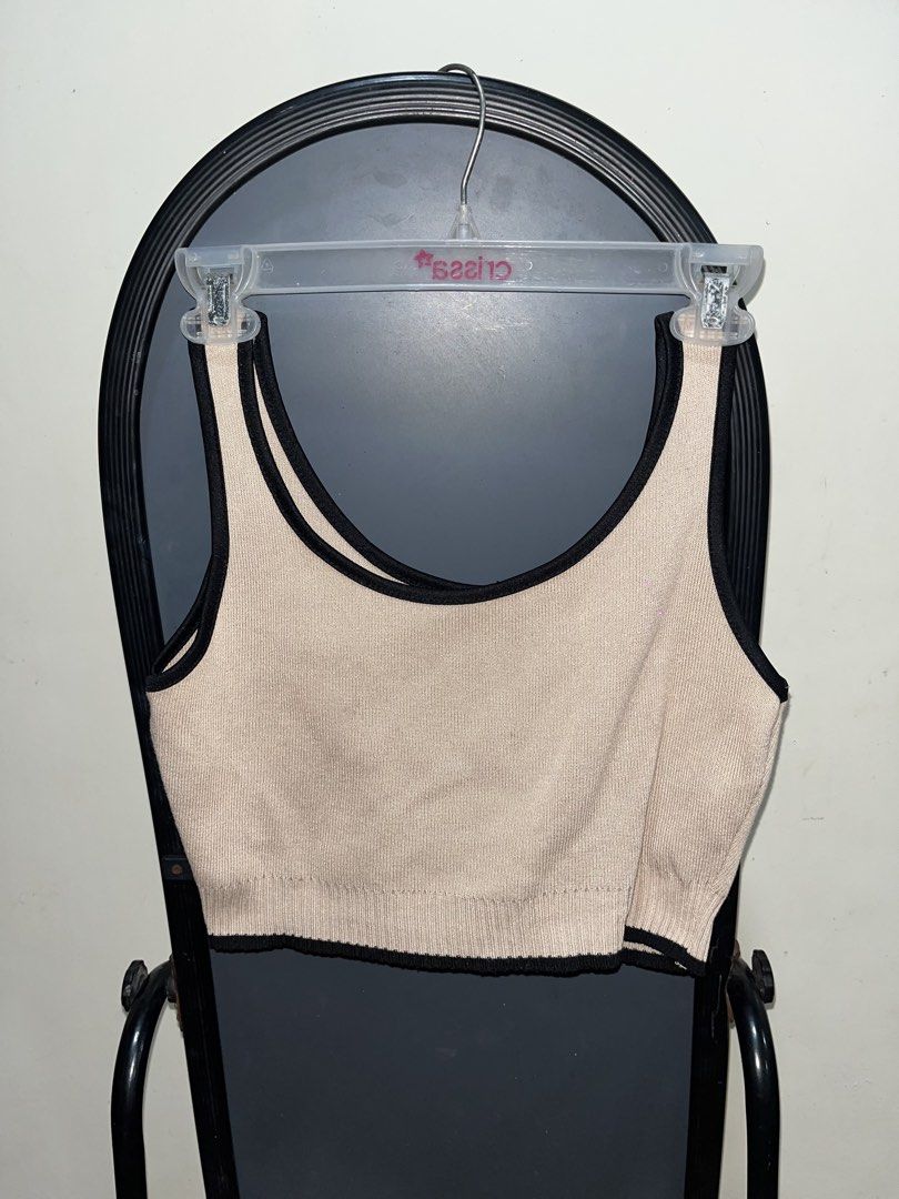 Beige and black ribbed knit crop top (Category: Sleeveless) located in Rizal. Submitted by bypc5678 (Listing ID 1465355086, Image 1). Description: - Color: Beige with chic black contrast trim - Material: Stretchy, comfortable ribbed knit - medium to large FREE for 300 peso purchase.