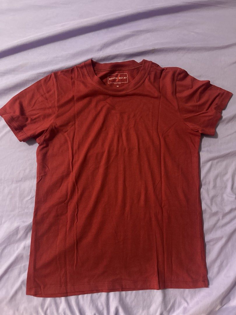 Bench Est. 87 Red T-Shirt Size M (Category: Shirts) located in Quezon City. Submitted by renzo__01 (Listing ID 1465243965, Image 1). Description: - Brand: Bench Est. 87 - Size: Medium - Color: Solid Red - Design: Crew neck with short sleeves - Fit: Standard casual fit - Condition: Clean fabric with clear interior collar tag.