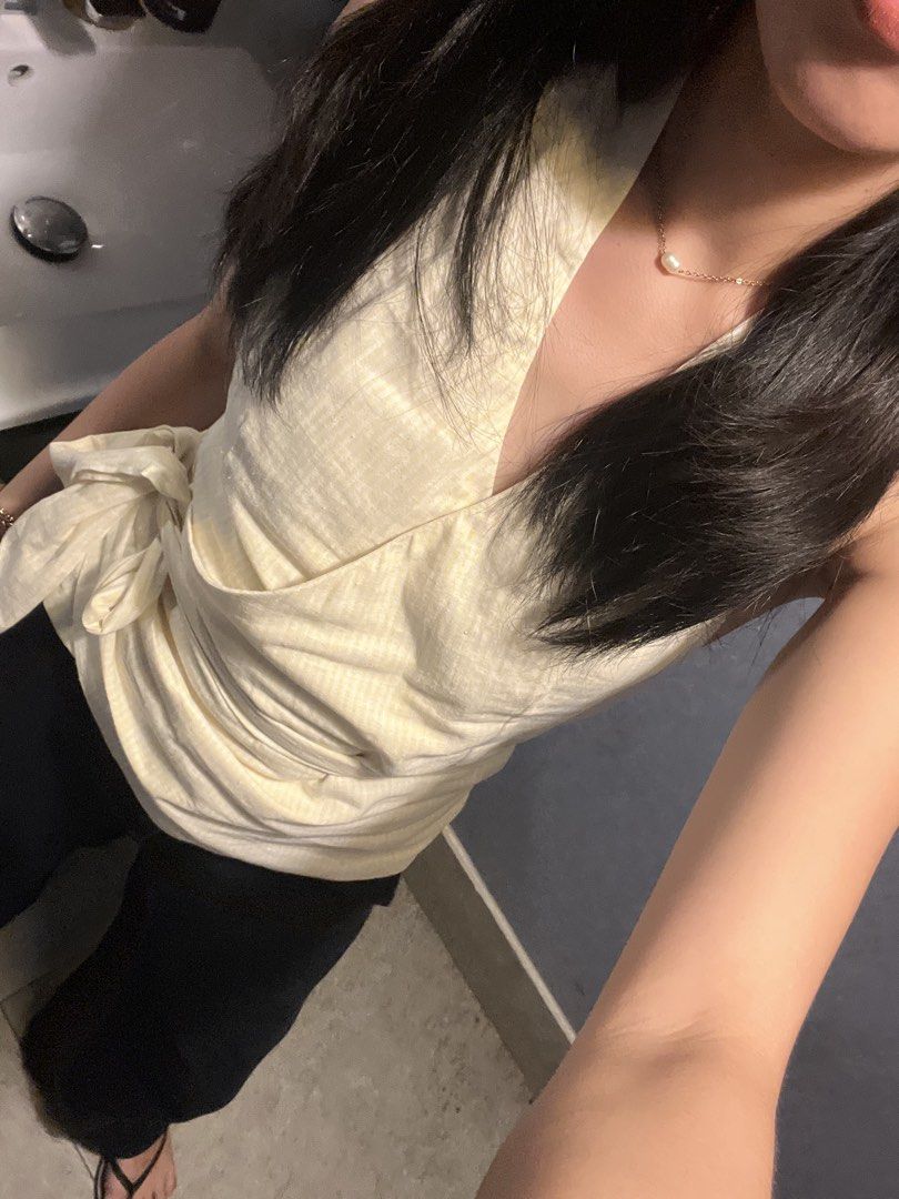 Beyond Collective Lily Top (XS) (Category: Sleeveless) located in Manila. Submitted by d.rosie844 (Listing ID 1465028972, Image 2). Description: - Style: Yellow and white striped halter top with a chic wrap-around design - Neckline: Flattering V-neck cut - Fit: Adjustable waist with a side tie ribbon for a custom fit - Versatility: Pairs easily with skirts or high-waisted shorts.