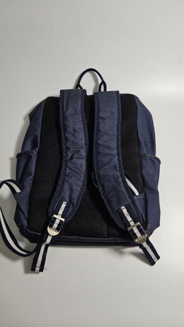 Bianchi Navy Blue Backpack with Celeste Interior (Category: Backpacks) located in Alfonso. Submitted by jbcamet (Listing ID 1465240439, Image 3). Description: - Brand: Bianchi - Color: Navy blue with bright celeste green interior - Material: Durable fabric with faux leather accents - Design: Signature Italian flag detail on the front pocket and outer label - Storage: 1 main compartment, 1 interior zippered pocket, and multiple slip compartments -