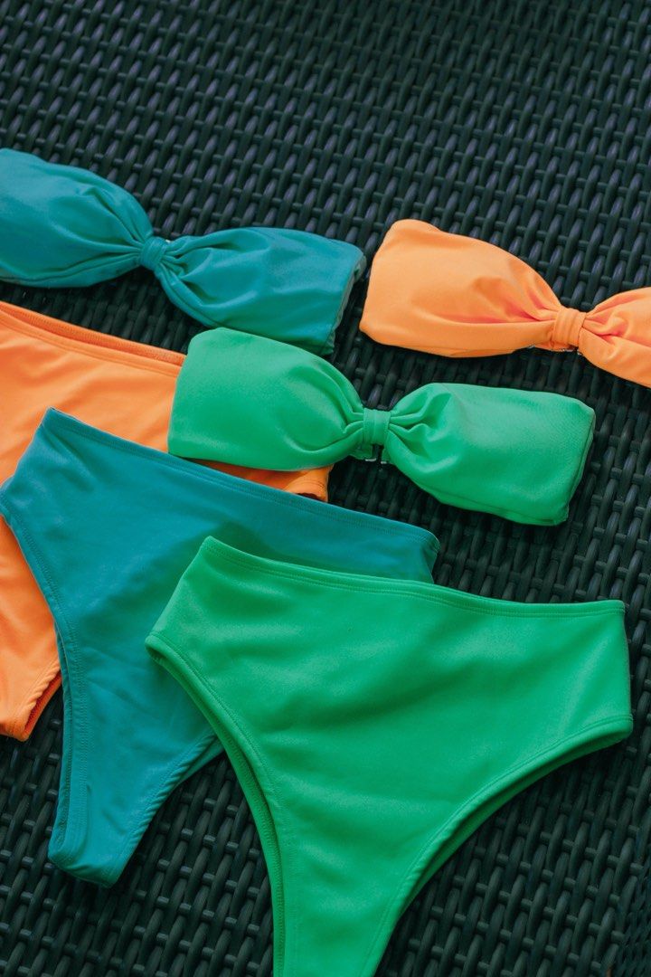 Bikini set in multiple bright colors (Category: Bikinis & Swimsuits) located in Las Pinas. Submitted by seeyuhhh (Listing ID 1465210362, Image 1). Description: - Bikini set with strapless bandeau tops and high-waist bottoms - Includes 3 vibrant colors: orange, green, and teal blue - Mix-and-match pieces to create multiple beach looks - Stretchy, super comfortable fabric ideal for swimming and sunbathing.
