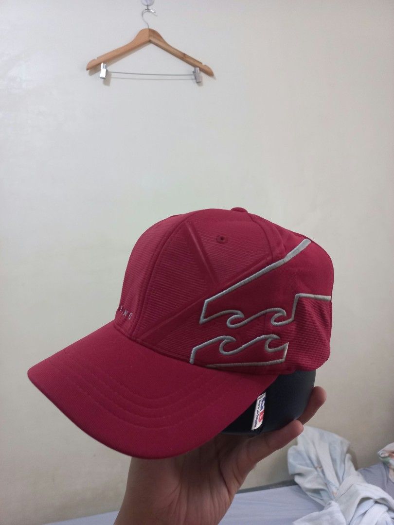 Billabong Red Flexfit Cap with Embroidered Wave Logo (Category: Caps & Hats) located in Davao. Submitted by thegraildept2026 (Listing ID 1465217116, Image 2). Description: - Brand: Billabong - Color: Vibrant red - Material: Textured corduroy style fabric - Fit: Flexfit band inside for a comfortable stretch - Details: Silver embroidered wave logo on the side, brand lettering on front and back - Condition: Clean and ready to wear.