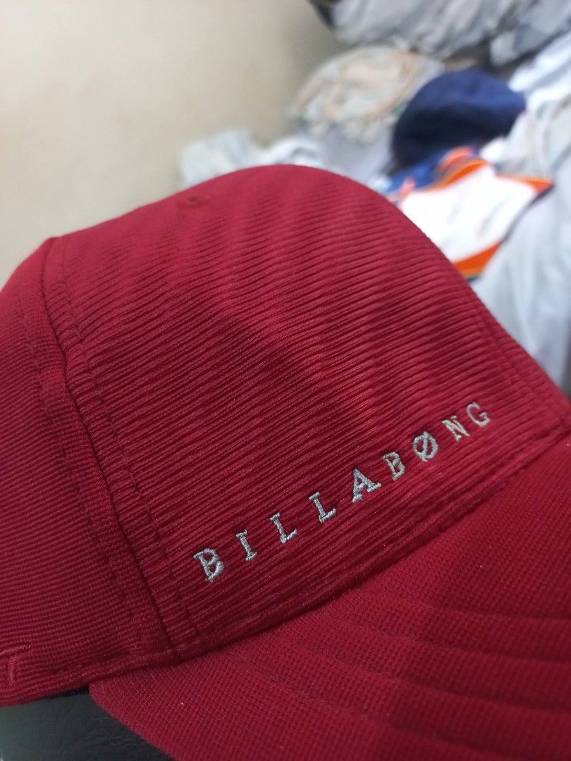 Billabong Red Flexfit Cap with Embroidered Wave Logo (Category: Caps & Hats) located in Davao. Submitted by thegraildept2026 (Listing ID 1465217116, Image 3). Description: - Brand: Billabong - Color: Vibrant red - Material: Textured corduroy style fabric - Fit: Flexfit band inside for a comfortable stretch - Details: Silver embroidered wave logo on the side, brand lettering on front and back - Condition: Clean and ready to wear.