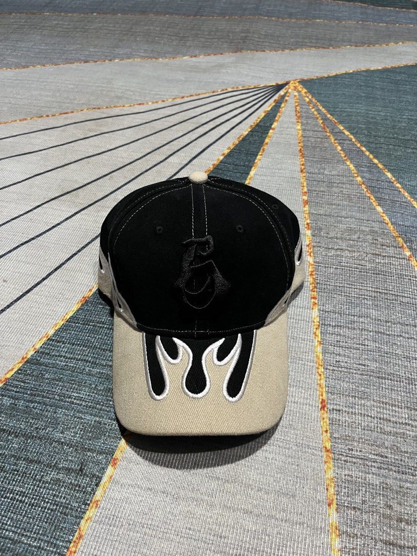 Black and Beige Flame Embroidery Baseball Cap (Category: Caps & Hats) located in Puerto Princesa. Submitted by dijaydj28 (Listing ID 1465325206, Image 1). Description: - Color: Black and beige with contrast white stitching - Design: Flame embroidery on brim and sides with front logo - Fit: Adjustable strap closure at the back - Style: Versatile neutral colors, perfect for casual everyday wear.