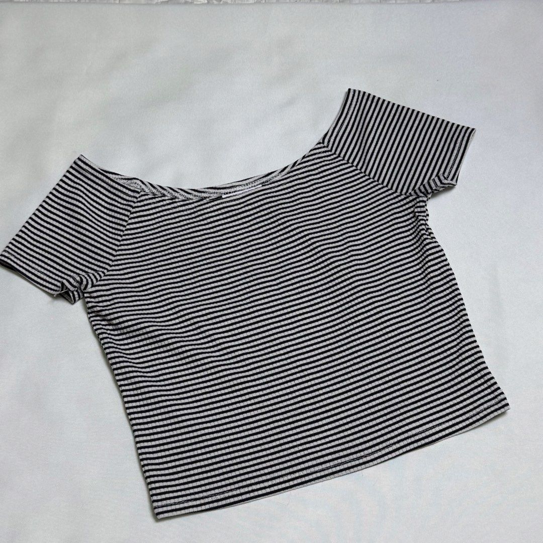 Black and white striped off-shoulder crop top (Category: Blouses) located in Santa Rosa. Submitted by kym_11 (Listing ID 1465336039, Image 1). Description: - Classic black and white horizontal stripes - Trendy off-shoulder neckline with short sleeves - Flattering cropped length - Comfortable ribbed fabric texture - Clean condition, minimal wear.