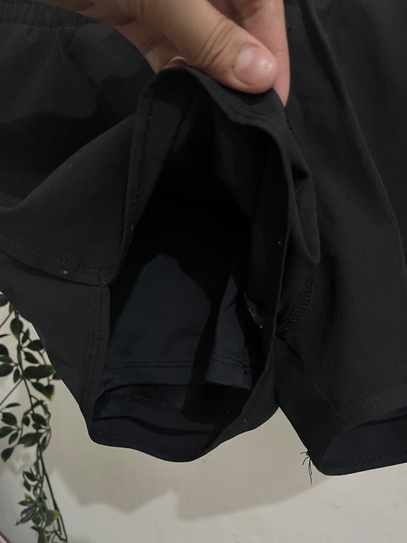 Black athletic running shorts with built-in liner (Category: Shorts) located in Quezon City. Submitted by lemonsandmelons (Listing ID 1465293248, Image 3). Description: - Color: Black - Ideal for workouts, running, or casual errands - Secure fit with an elastic waistband and adjustable drawstring - Flattering curved hem design on the sides - Built-in liner shorts for extra coverage and comfort - Lightweight and breathable fabric.