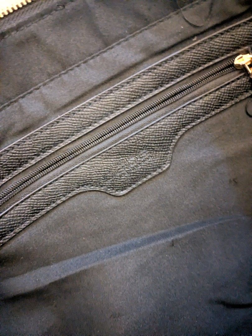 Black Bebe Tote Bag With Gold Hardware (Category: Tote Bags) located in Taguig. Submitted by roxie0419 (Listing ID 1465380346, Image 3). Description: - Brand: bebe - Material: Premium black faux leather with gold-tone hardware and metal logo - Closure: Zip-top closure for added security - Interior: Spacious black fabric lining with 1 zippered pocket and slip pockets - Handles: Sturdy double handles with structured sides - Condition: Clean inside 