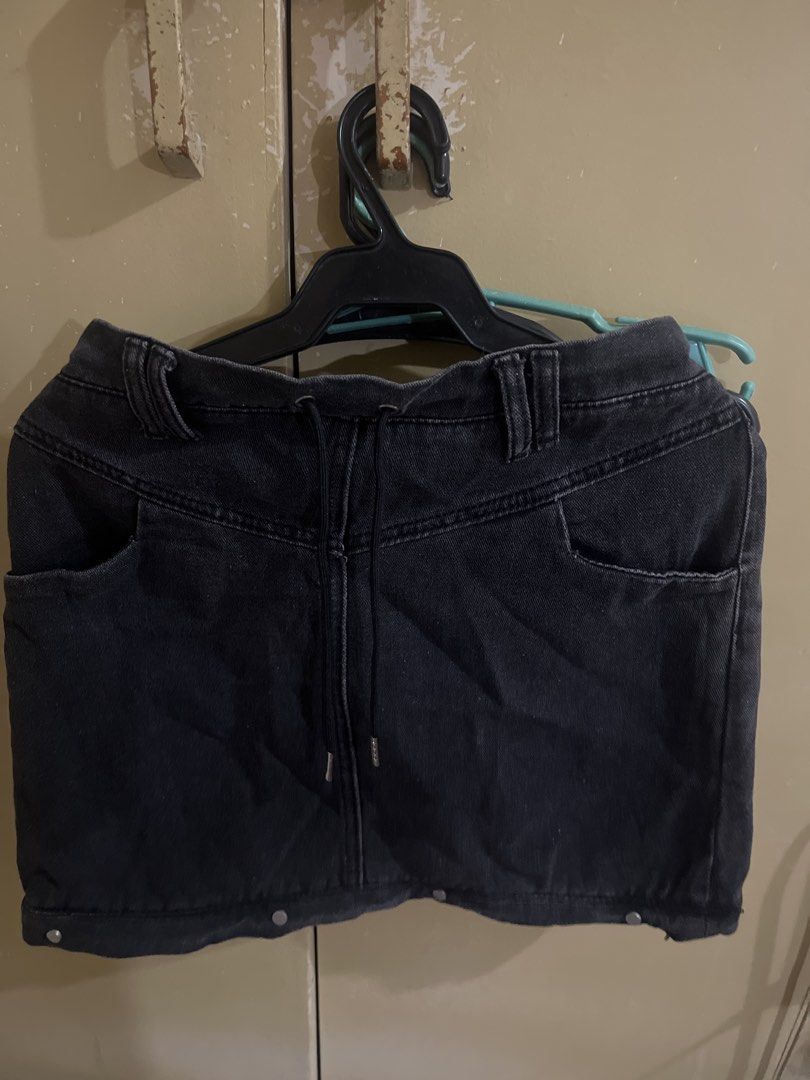 Black Denim Skirt with Drawstring and Front Pockets (Category: Skirts) located in Manila. Submitted by pikbit_10231214 (Listing ID 1465323912, Image 3). Description: - Mini Skirt (Size 29-30 waist and hips) - Color/Finish: Black washed denim - Waistband: Adjustable drawstring with silver metal tips + elastic back for comfort - Pockets: Two deep functional front pockets - Details: Decorative bottom hem buttons and belt loops - Style: Easy to pair 