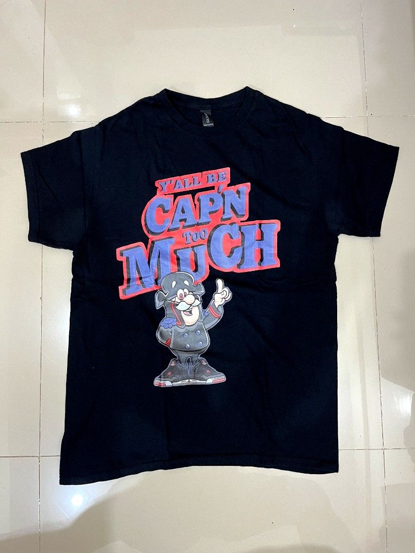 Black Graphic Tee Y'all Be Cap'n Too Much (Category: Activewear) located in Caloocan City. Submitted by bmcfly (Listing ID 1465231221, Image 1). Description: - Color: Black - Small to medium - Fit: Regular fit, standard crew neck - Brand/Tag: Gildan - Design: Large front graphic featuring a cartoon pirate and bold blue and red text 'Y'ALL BE CAP'N TOO MUCH' - Condition: Excellent pre-loved condition, ready to wear.
