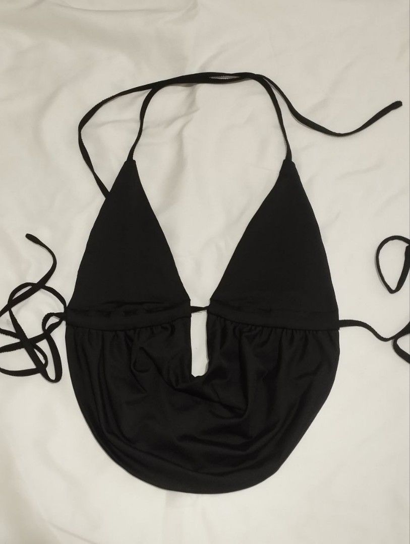 Black halter top open back plunge neckline (Category: Sleeveless) located in Manila. Submitted by nicole_alega (Listing ID 1465226709, Image 3). Description: - Color: Black - Style: Halter top with plunging neckline and open back - Fit: Lightweight, body-hugging fabric with adjustable tie straps at neck and back - Perfect for a stylish night out!.