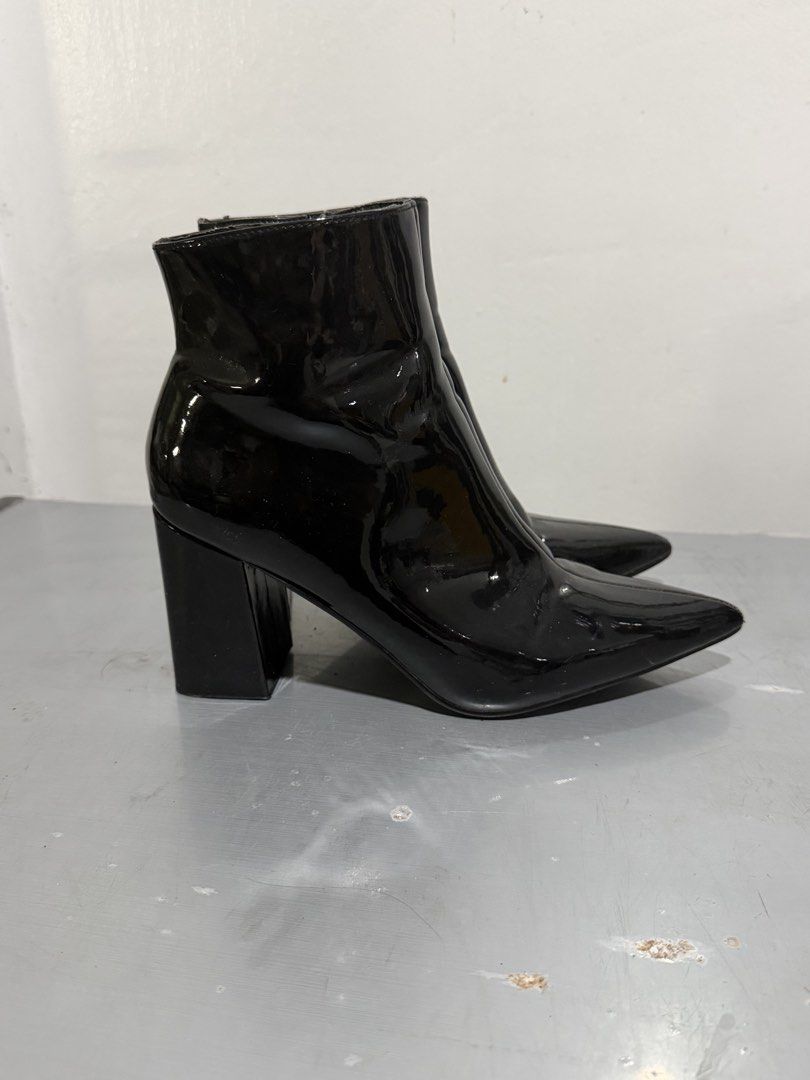 Black Patent Leather Pointed Toe Ankle Boots (Category: Boots) located in Santa Rosa. Submitted by leana_yna (Listing ID 1465295648, Image 2). Description: - Style: Black patent leather ankle boots with pointed toes and block heels - Closure: Side zipper for easy slip-on - Finish: Glossy, reflective finish in clean condition with minimal scuffs - Heel: Solid chunky heel for comfortable support.