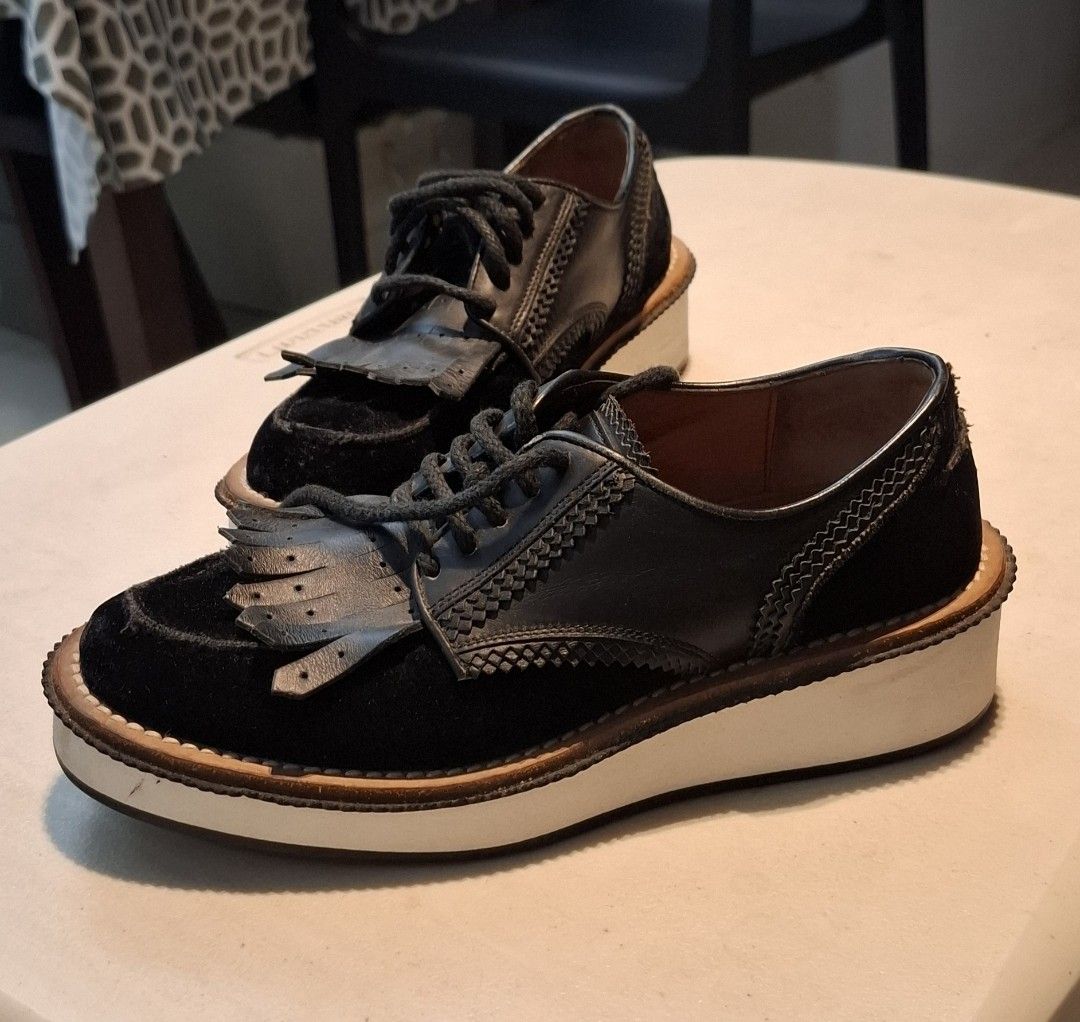 Black Platform Fringe Creepers (Category: Loafers) located in Pasay City. Submitted by al1son18 (Listing ID 1465253640, Image 1). Description: - Color & Style: Black platform shoes with a chunky white sole for a bold look - Material: Premium mix of suede and leather on the upper - Details: Laced front with a removable fringe kiltie and intricate side stitching - Comfort: Features a comfortable inner lining for all-day wear - Versatility: Great st