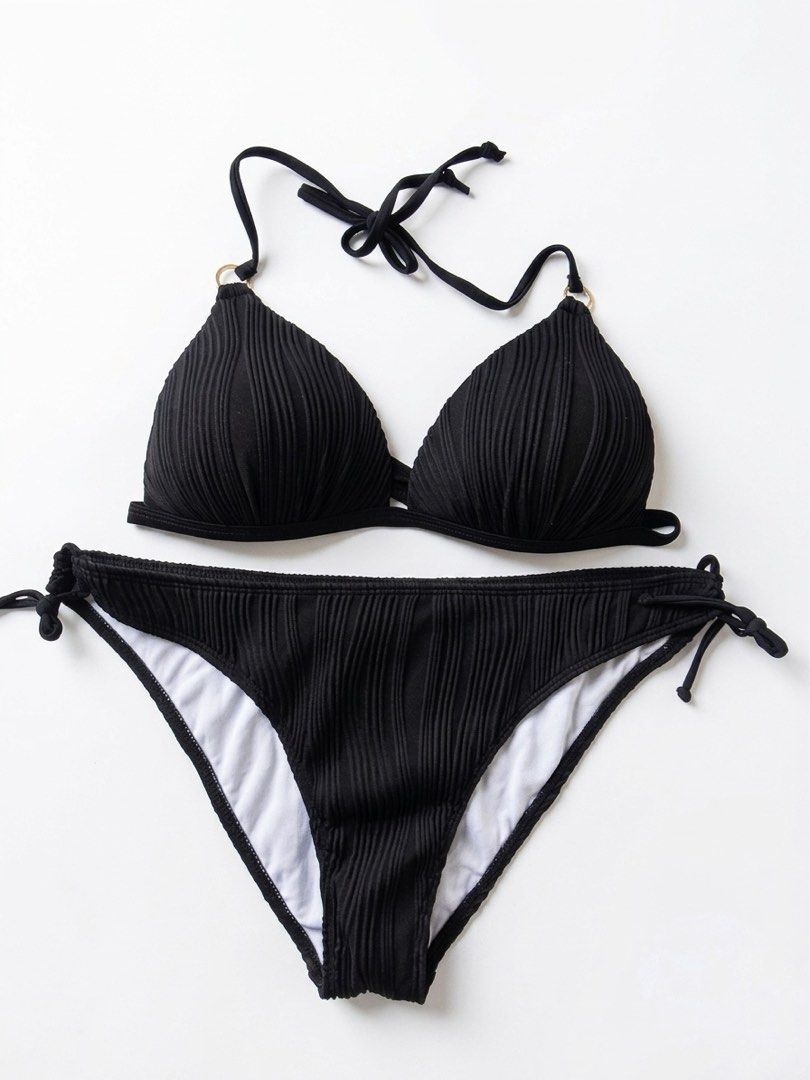 Black Ribbed Two-Piece Bikini with Side Ties (Category: Bikinis & Swimsuits) located in Manila. Submitted by ynaamo (Listing ID 1465263802, Image 1). Description: - Style: Classic black ribbed two-piece swimsuit - Top: Triangle halter neck with stylish small gold rings - Bottoms: Adjustable side ties for a custom fit with white inner lining - Perfect for: Beach days, resort wear, and poolside lounging - Condition: Brand new / Excellent quality.