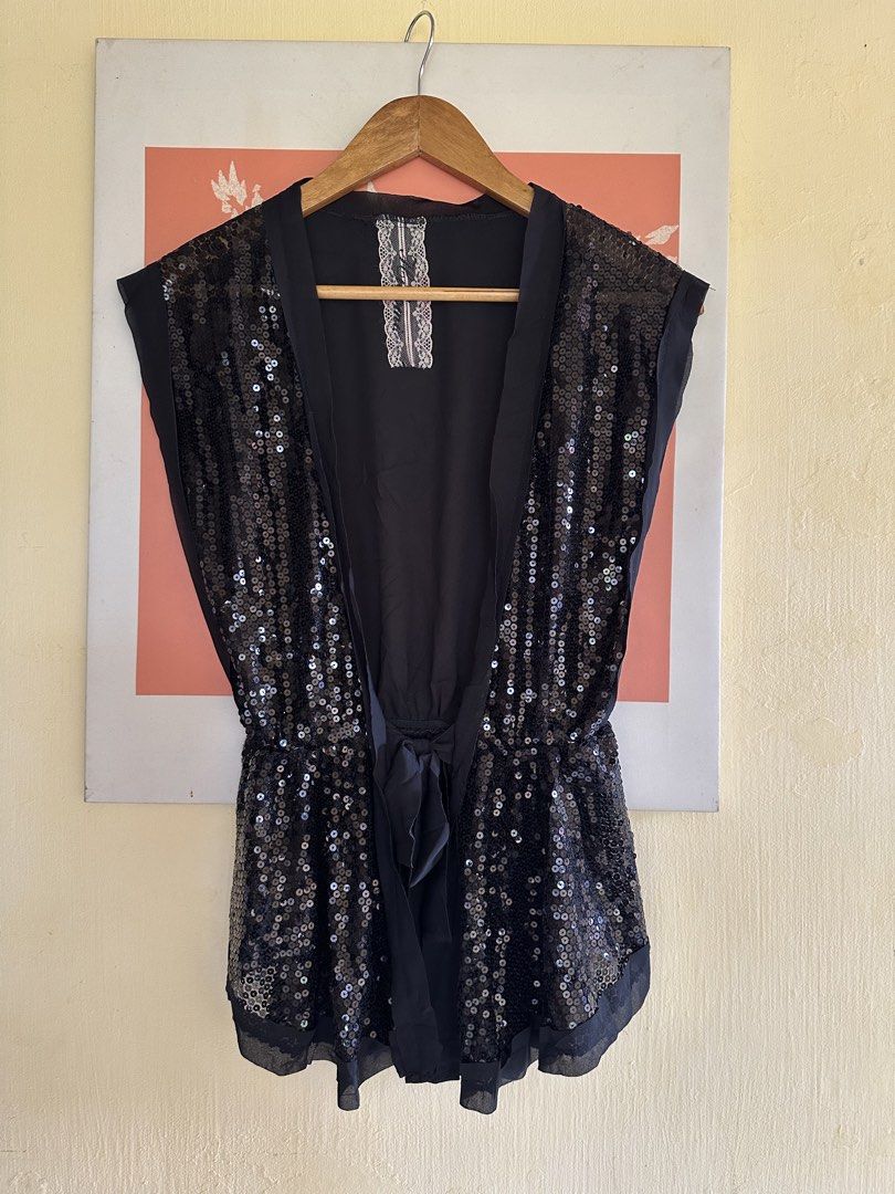 Black Sequin Open Front Top with Ribbon Tie Medium-Semi L (Category: Sleeveless) located in Calapan. Submitted by shakalak (Listing ID 1465228345, Image 1). Description: Black top covered entirely in sequins on the front panels. Sheer fabric details along the shoulders, hem, and open front placket. Tie ribbon at the waist to cinch it in. Cute lace trim detail on the inner back neck tag area. Sleeveless cut with a drapey fit..