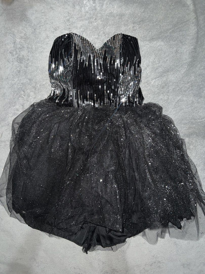 Black Sequins Tulle Strapless Cocktail Dress (Category: Dresses) located in Cainta. Submitted by dyclutterxoxo (Listing ID 1465333385, Image 1). Description: - Style: Black strapless party romper - Bodice: Shimmering silver sequins with a flattering sweetheart neckline - Bottoms: Fluffy tulle overlay with glitter sparkles covering the shorts - Back Details: Adjustable lace-up corset back with a satin ribbon tie closure - Perfect For: Parties, nig