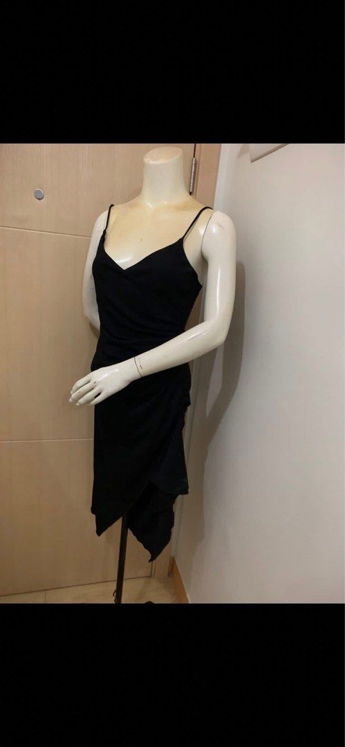 Black Spaghetti Strap Asymmetric Hem Dress (Category: Dresses) located in Manila. Submitted by spaceshop12345 (Listing ID 1465308905, Image 2). Description: - Color: Sleek black - Design: Spaghetti straps with a flattering sweetheart neckline - Cut: Fitted midi length with a trendy asymmetric draped wrap hem - Versatility: Perfect for evening outings, dates, and parties - Condition: Brand new / Excellent (ready to wear).