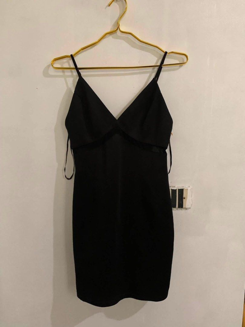 Black Spaghetti Strap Bodycon Mini Dress (Category: Dresses) located in Manila. Submitted by spaceshop12345 (Listing ID 1465309536, Image 1). Description: - Color: Black - Style: Bodycon fit, hits above the knee - Details: V-neckline with mesh cutouts under the bust - Straps: Thin, adjustable spaghetti straps - Condition: Clean and ready to wear - Perfect for: Nights out, parties, and date nights.