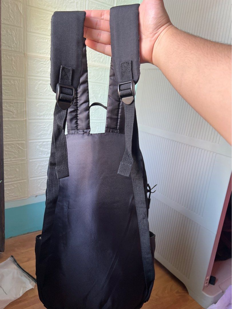 Black Sports Backpack with Adjustable Straps (Category: Backpacks) located in Manila. Submitted by go.kluttery (Listing ID 1465235008, Image 2). Description: - Color: Black with a simple sports label on the front pocket - Closure: Secure top zip closure - Pockets: Convenient side pockets for small water bottles and a built-in inner compartment - Interior: Fully lined in clean grey fabric - Comfort & Carry: Adjustable shoulder straps and a sturdy 