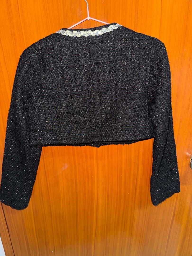 Premium Tweed Crop Jacket (Category: Coats, Jackets and Outerwear) located in Caloocan City. Submitted by mylove326 (Listing ID 1465351156, Image 3). Description: - Color: Black tweed with subtle metallic thread weave - Design: Round neckline with silver sequins and front button closure - Details: 4 statement jewelled buttons and 2 front chest pockets - Fit: Structured shoulders, long sleeves, and a flattering waist-length crop - Condition: Excel
