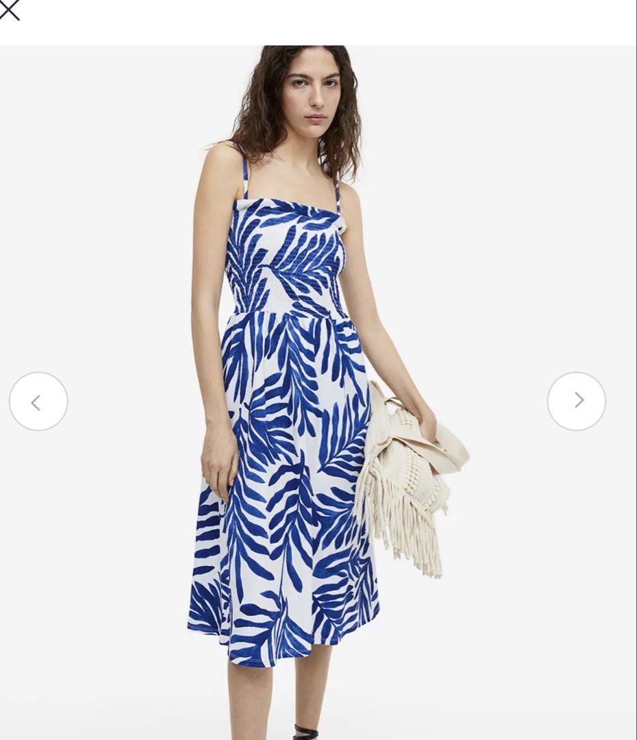 Blue and White Leaf Print Midi Dress (Category: Dresses) located in General Santos City (Dadiangas). Submitted by pina_cxladah (Listing ID 1465287814, Image 2). Description: - Style: Blue and white leaf print midi dress - Fit: Smocked bodice with thin adjustable straps and a flared skirt hitting mid-calf - Material: Lightweight crinkle texture fabric, perfect for warmer days - Condition: Worn once, freshly washed, and ready to ship.