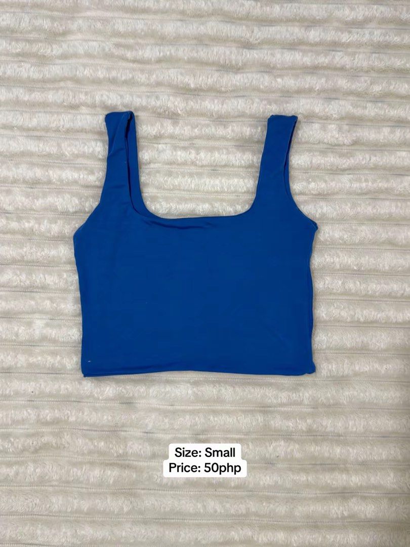 Blue Crop Top Square Neck Small (Category: Sleeveless) located in Pasig City. Submitted by jamie.sebuc (Listing ID 1465237731, Image 1). Description: - Color: Bright blue - Size: Small - Style: Clean minimalist design with square neckline and wide straps - Material: Soft stretch fabric for a comfortable fit - Versatile: Easy to pair with high-waisted jeans or skirts - Condition/Note: Priced low for quick sale.