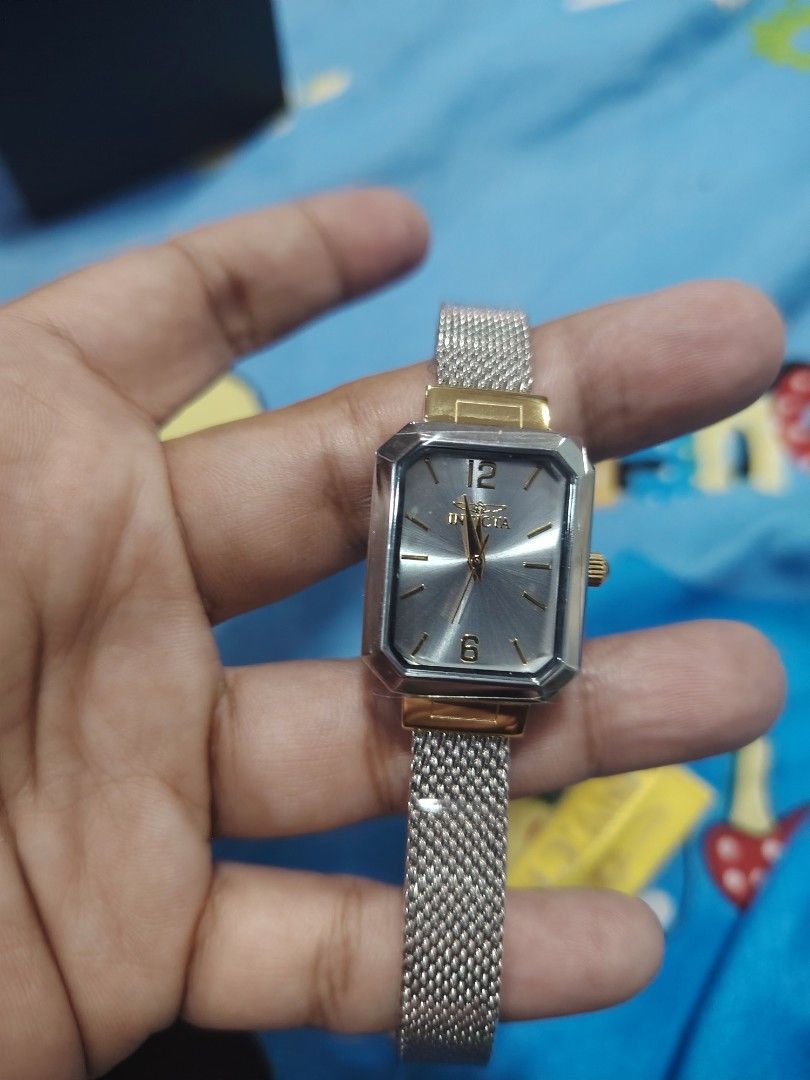 Bnew Invicta Angel stainless watch (Category: Women's Watches) located in Quezon City. Submitted by G.E.M18 (Listing ID 1465324979, Image 1). Description: Bnew Invicta Angel stainless watch 21mm.